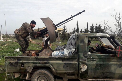 Syrian army soldiers gesture in southern Idlib province, Syria in this handout released by SANA on Thursday. (Reuters)