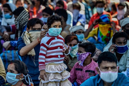 Hundreds of migrant workers from Delhi, Haryana and even Punjab reached Anand Vihar, Ghazipur and Ghaziabad's Lal Kuan area after taking arduous treks of many kilometers on foot to take buses to their villages. (Image: PTI/File)
