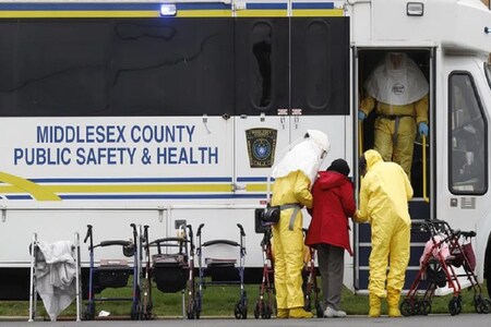 In this representative image, medical officials aid a resident from St. Joseph's nursing home to board a bus, after a number of residents tested positive for coronavirus disease (COVID-19) in New Jersey, U.S. (Reuters)