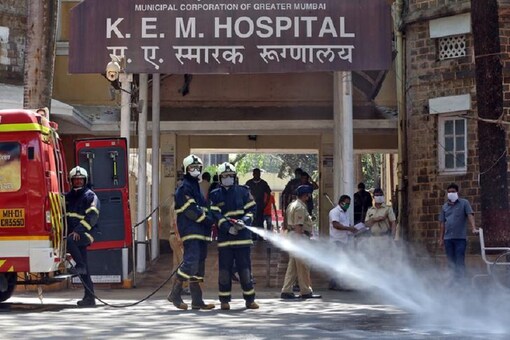Firefighters disinfect the exteriors of a government-run hospital to limit the spreading of coronavirus disease (COVID-19), in Mumbai, India. REUTERS/Prashant Waydande