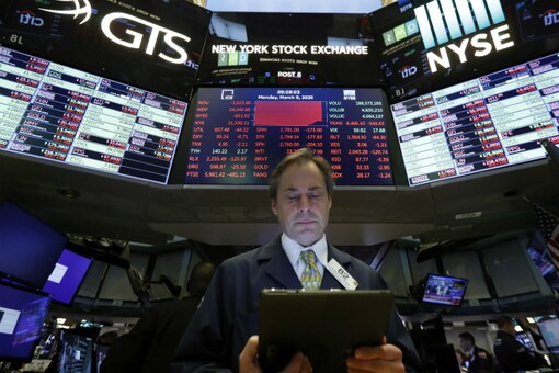 File photo of a trader works on the floor of the New York Stock Exchange. (AP Photo/Richard Drew) 