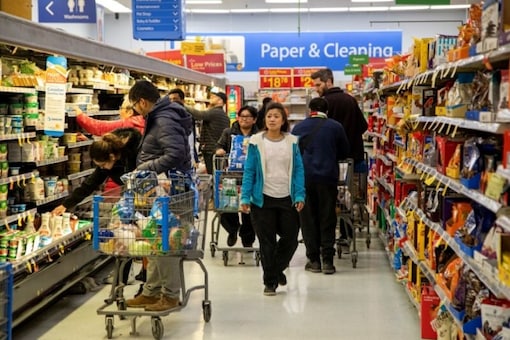 Image for representation: People shop at a Walmart Supercentre amid coronavirus fears spreading in Toronto, Ontario, Canada March 13, 2020. REUTERS/Carlos Osorio