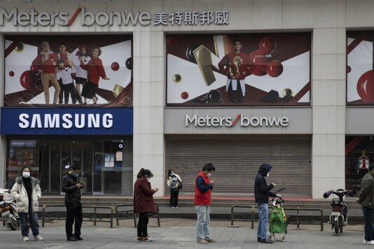 Representative Image. Residents wearing masks and practising social distancing line up to enter a supermarket in Wuhan in central China's Hubei province on April 3, 2020. (AP Photo/Ng Han Guan)