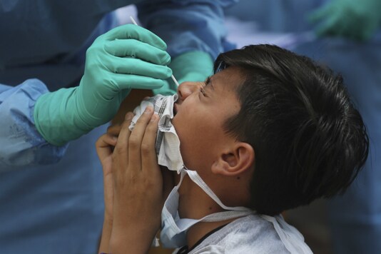 File photo of a boy undergoing a swab test during lockdown to control the spread of the new coronavirus. (AP)