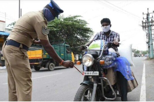For representation only: Tamil Nadu Police paints the number plate of a two-wheeler.
