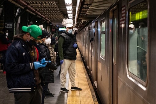 File photo: People wearing face masks are seen in the Times Square subway station during the outbreak of the coronavirus disease (COVID-19) in New York City, US. (Reuters)