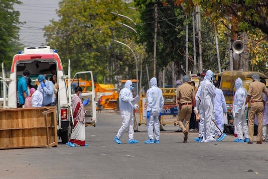 Medics take COVID-19 suspects to a quarantine centre in Noida. (PTI)