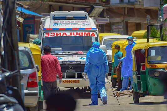 For Representation. Police and health officials arrive for inspection at Tipu Nagar in Bengaluru. (PTI)