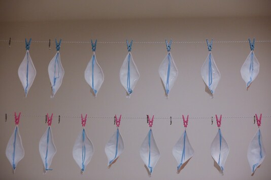 FILE PHOTO: N95 face masks hang to be sterilized with UVC light, amid the coronavirus disease (COVID-19) outbreak, at the Cleveland Clinic hospital in Abu Dhabi, United Arab Emirates, April 20, 2020. Picture taken April 20, 2020.  REUTERS/Christopher Pike