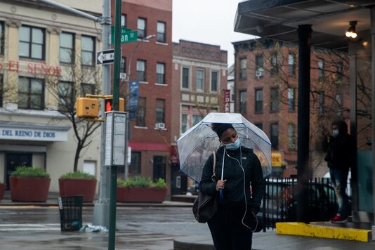 A woman wearing a protective mask carries wait for a bus during the outbreak of the coronavirus disease (COVID-19) in the Brooklyn borough of New York City, US, April 26, 2020. (Image: REUTERS)