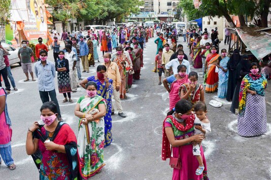 People queue up for relief materials in Hyderabad during lockdown. (PTI)