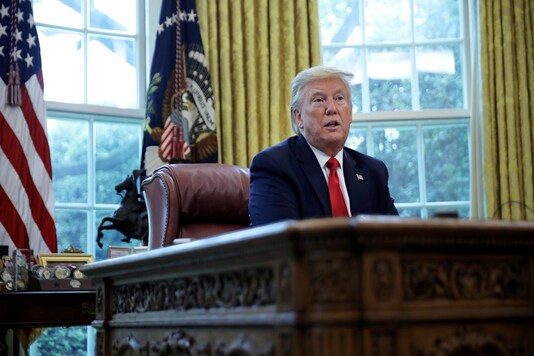 US President Donald Trump answers questions during an interview with Reuters about China, the novel coronavirus (COVID-19) pandemic and other subjects in the Oval Office of the White House in Washington, U.S., April 29, 2020. REUTERS/Carlos Barria