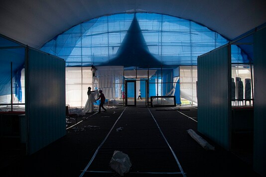 Workers prepare a quarantine center at the Sarusojai sports complex in Gauhati, Assam. (AP)