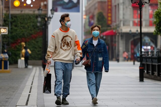 In this representational image, a couple wears protective masks amid coronavirus outbreak. (AP)