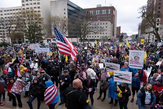 Protesters rally outside of the state capitol building before the vote on the extension of Governor Gretchen Whitmer's emergency declaration/stay-at-home order due to the coronavirus disease (COVID-19) outbreak, in Lansing, Michigan, US. (Reuters)