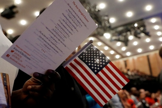 New citizens stand during a US Citizenship and Immigration Services (USCIS) naturalization ceremony at the New York Historical Society Museum and Library in Manhattan, New York, US. (Reuters) New citizens stand during a US Citizenship and Immigration Services (USCIS) naturalization ceremony at the New York Historical Society Museum and Library in Manhattan, New York, US. (Reuters)