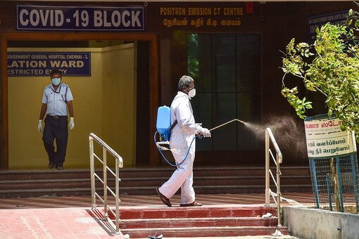 A health worker sprays disinfectant at Rajiv Gandhi Government General Hospital in Chennai. (PTI Photo)