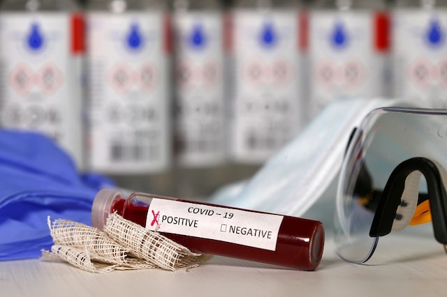 Fake blood is seen in test tubes labelled with the coronavirus (COVID-19). REUTERS/Dado Ruvic/Illustration