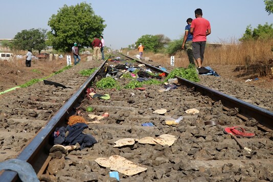 The belongings of victims lie scattered on the railway track after a train ran over migrant workers sleeping on the track in Aurangabad district on Friday. (Reuters)