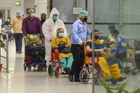 Passengers from Sharjah arrive in Lucknow (PTI)