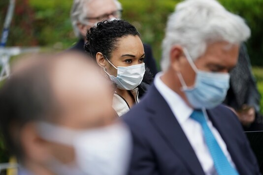 Members of the White House press corps including Francesca Chambers of McClatchy and John Roberts of Fox News wear protective face masks as US President Donald Trump holds a coronavirus disease outbreak response press briefing in the Rose Garden of the White House in Washington on May 11. (REUTERS/Kevin Lamarque)