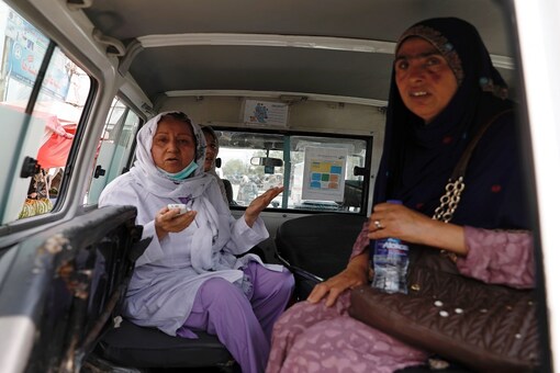 Afghan women sit in an ambulance after being rescued by security forces during an attack and gunfire at a hospital in Kabul (Reuters)