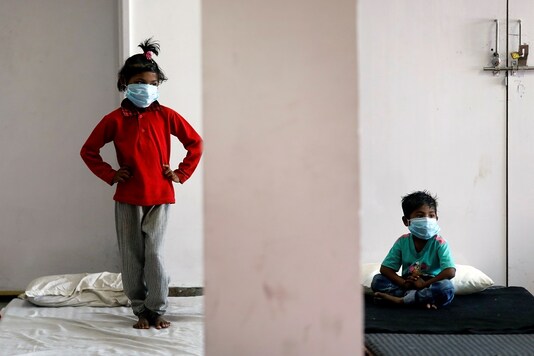 For representation only: Children of migrant workers wear protective masks inside a sports complex turned into a shelter in New Delhi. (Reuters)