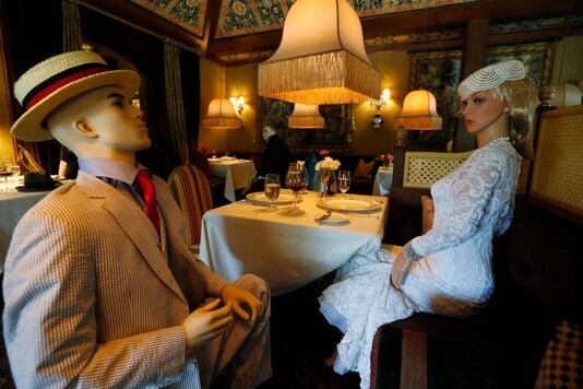 Mannequins provide social distancing at the Inn at Little Washington as they prepare to reopen their restaurant Thursday May 14, 2020, in Washington, Va. The manager say that every other table will have mannequins for social distance guidance when, according to state guidelines, the 5-star restaurant will be allowed reopen on May 29th. (AP Photo/Steve Helber)


