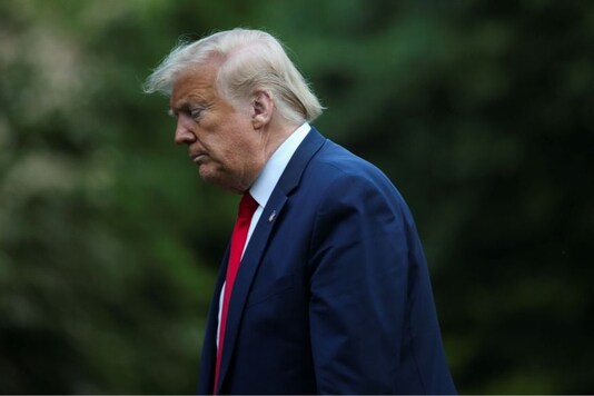 U.S. President Donald Trump walks from the Marine One helicopter to the White House after arriving from travel to Allentown, Pennsylvania on the South Lawn of the White House in Washington, U.S., May 14, 2020. REUTERS/Tom Brenner
