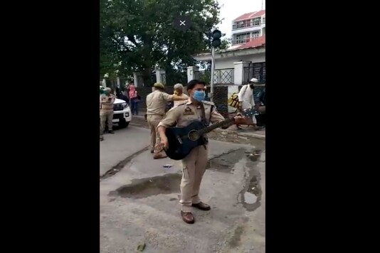 Cop singing outside railway station in Jammu.