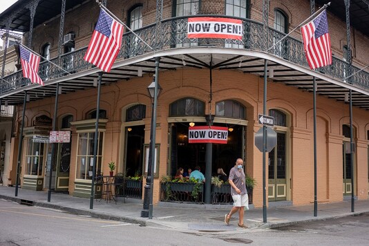 FILE PHOTO: Patrons eat at Pere Antoine Restaurant after restrictions were eased from two months under the coronavirus disease (COVID-19) lockdown, including allowing for 25% of permitted occupancy in stores and restaurants, in New Orleans, Louisiana, U.S., May 16, 2020. REUTERS/Kathleen Flynn/File Photo