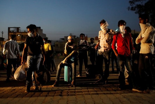 For representation: Migrant workers and their families wait for a bus to take them to a railway station to board a train to their home state of Uttar Pradesh, after a limited reopening of India's giant rail network following a nearly seven-week lockdown to slow the spreading of the coronavirus disease (COVID-19), in Ghaziabad. (Image: Reuters)