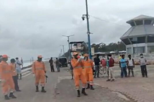 NDRF personnel make announcements ahead of Cyclone Amphan hitting the coast