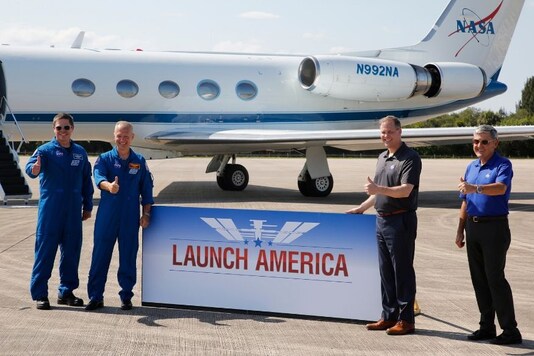 NASA astronauts Bob Behnken and Doug Hurley pose with NASA Administrator Jim Bridenstine  and Kennedy Space Center Director Bob Cabana after they arrived at the Kennedy Space Center to prepare for the launch of SpaceX's Crew Dragon capsule, at Cape Canaveral, Florida, U.S. May 20, 2020. REUTERS/Joe Skipper
