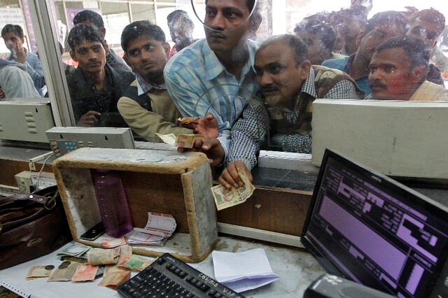 A file photo shows passengers at a ticket window at a railway booking counter in Allahabad. (Reuters)