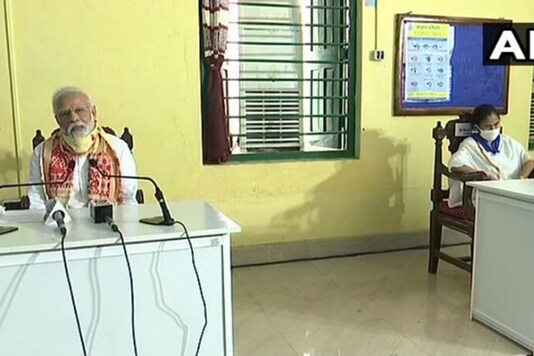 Prime Minister Narendra Modi and CM Mamata Banerjee on Cyclone Amphan situation in West Bengal. (Credits: ANI)