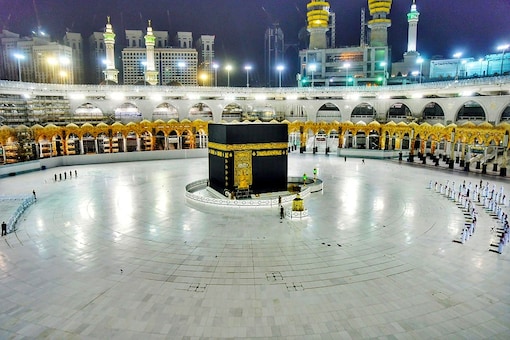 Muslims pray during the Laylat al-Qadr, or Night of Power, the holiest night for Muslims, while practicing social distancing, following the outbreak of the coronavirus disease (COVID-19), at the Grand Mosque in Mecca, Saudi Arabia. (Reuters)
