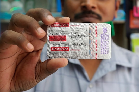 A chemist holds a pack of hydroxychloroquine tablets in Mumbai. (AP)