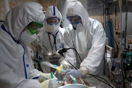 File photo of doctors performing tracheal intubation of a coronavirus patient on artificial lung respiration at an intensive care unit of the Filatov City Clinical Hospital in Moscow, Russia. (AP)