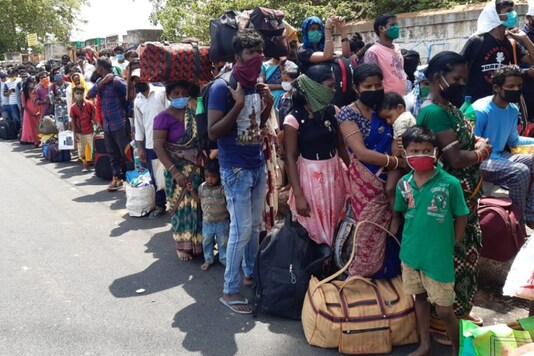 Long queues seen at Palace Ground in Bengaluru as people line up to register themselves to return to their native districts in Odisha. (ANI)