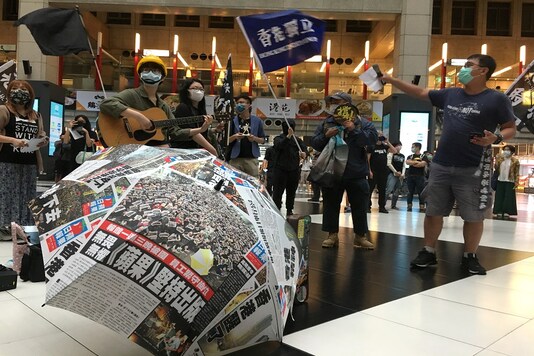 File photo of protesters holding banners in support of Hong Kong pro-democracy demonstrators at a rally against the Chinese government’s national security legislation. 
(REUTERS)