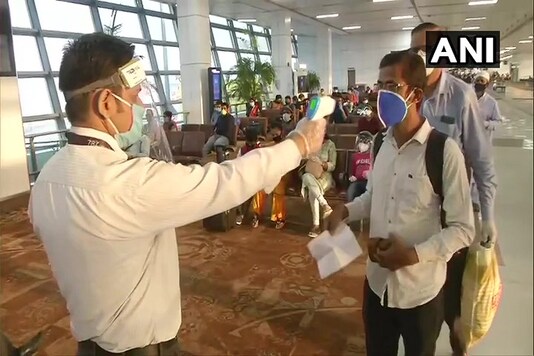 Passengers screened using a thermometer gun before boarding Vistara - Delhi to Bhubaneswar (Odisha) flight, scheduled to depart from IGI Airport, Terminal-3 in Delhi at 6:50 am today. (Image: ANI)