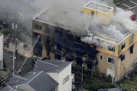FILE PHOTO : An aerial view shows firefighters battling fires at the site where a man started a fire after spraying a liquid at a three-story studio of Kyoto Animation Co. in Kyoto, western Japan, in this photo taken by Kyodo, July 18, 2019. Mandatory credit Kyodo/via REUTERS/File Photo
