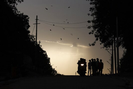 People ride a bike during a hot summer day. (Image: AP) People ride a bike during a hot summer day. (Image: AP)