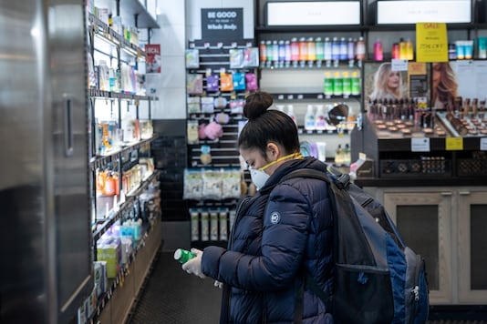 A customer wearing a protective mask shops in a store following the outbreak of coronavirus disease (COVID-19), in New York City, US, March 16, 2020. (Image: REUTERS)