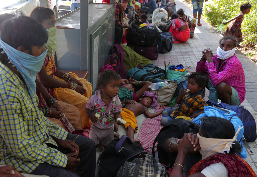 Migrant workers from Odisha wait for transportation to return to their home state, in Hyderabad. (Image: AP)