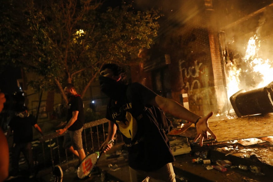 Protesters demonstrate outside the 3rd Precinct of the Minneapolis Police Department, in Minneapolis. (Image: AP)