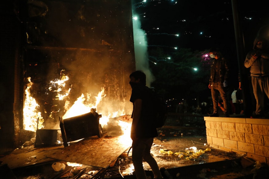  Protesters set fires at the 3rd Precinct of the Minneapolis Police Department, in Minneapolis. Violent protests over the death of George Floyd, the black man who died in police custody, broke out in Minneapolis for a third straight night. (AP Photo/John Minchillo)