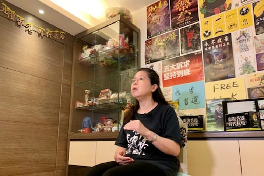 Office worker Daisy Lam speaks to Reuters about her experience in joining the annual June 4 candlelight vigil, at her living room in Hong Kong, China June 1, 2020. Picture taken June 1, 2020. REUTERS/Yoyo Chow