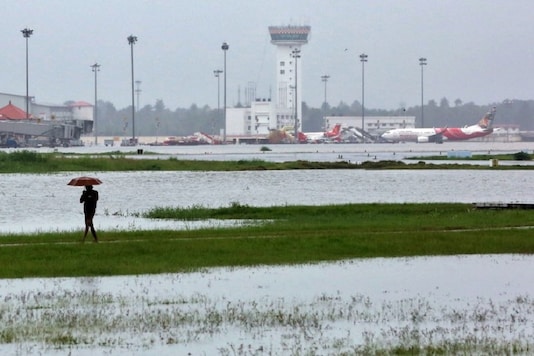 FILE PHOTO: A man walks inside the flooded Cochin international airport after the opening of Idamalayar, Cheruthoni and Mullaperiyar dam shutters following heavy rain, on the outskirts of Kochi, India, August 15, 2018. REUTERS/Sivaram V FILE PHOTO: A man walks inside the flooded Cochin international airport after the opening of Idamalayar, Cheruthoni and Mullaperiyar dam shutters following heavy rain, on the outskirts of Kochi, India, August 15, 2018. REUTERS/Sivaram V